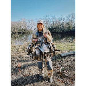 a woman catching a duck